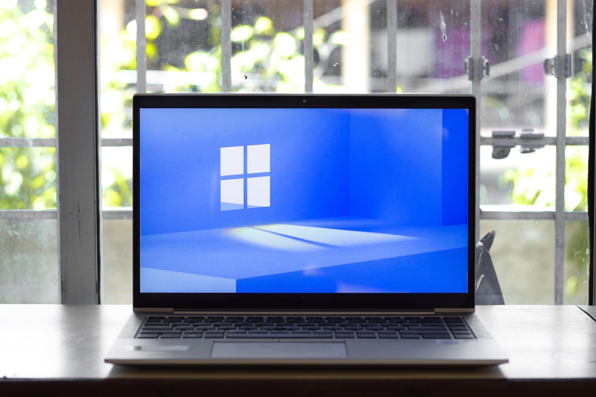Windows 11 logo on laptop screen stock image